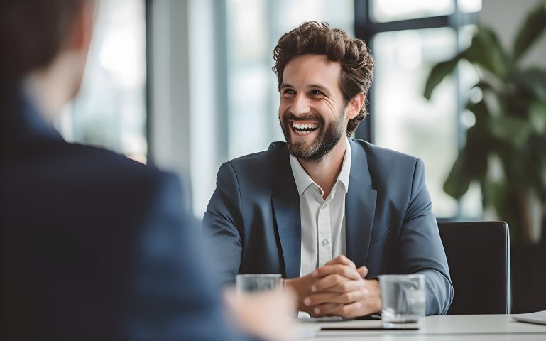Happy smiling executive discussing discuss project, consider contract terms and conditions, solve business. Formal meeting event concept